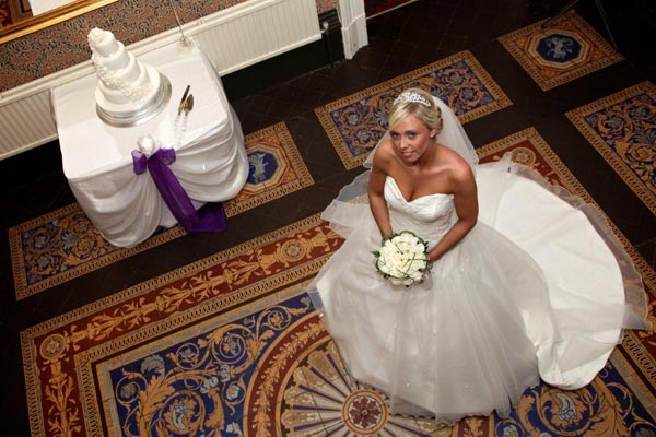 Bride looking up in the hallway of the Mansion House